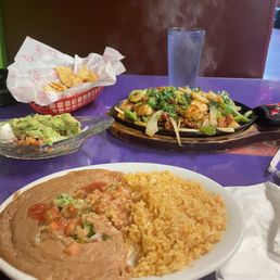 Rice refried beans & sizzling chicken & shrimp platter