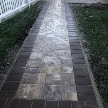 McMillan Landscape Contractors - a brick walkway in a backyard - Masonry/Concrete Near Me McMillan Landscape Contractors - a brick walkway in a backyard - Masonry/Concrete Near Me
