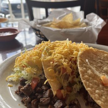 Los Primos Mexican Grill - Taco Tuesday with beef fajita dressed Tex-Mex style - Mexican Near Me - Houston, Texas