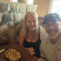 Two happy customers with lunch fajitas. Two happy customers with lunch fajitas.