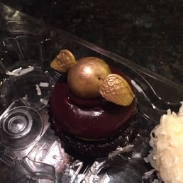Golden Snitch toppers on Peanut Butter cupcakes. Golden Snitch toppers on Peanut Butter cupcakes.