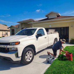 Certified Outdoor Solutions - Technician performing sprinkler repair.