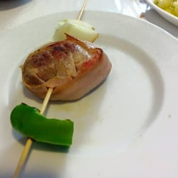 Al Compas - Tapa - pork tenderloin wrapped with bacon shish kebab with onion and bell pepper