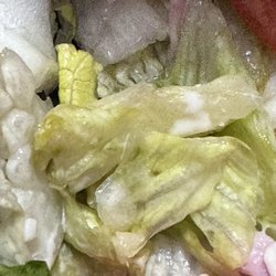 Hungry Howie's Pizza - Wilted soggy lettuce. The bottom of the container was soaked with water.