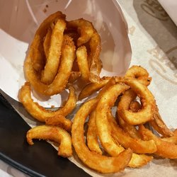 Arby's - Curly Fries (Small) and partially eaten