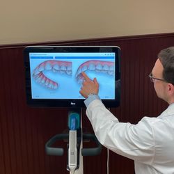 Rocky Point Orthodontics - Dr. Miller educating a patient on our iTero digital scanner