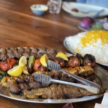 Pardis - a large platter of food on a wooden table - Persian/Iranian Near Me - Glendale, California