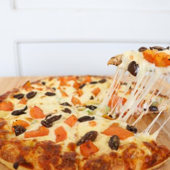 Bow Tie Pizza - a slice being lifted by a pizza cutter - Pizza Near Me - Calgary, Alberta Bow Tie Pizza - a slice being lifted by a pizza cutter - Pizza Near Me - Calgary, Alberta