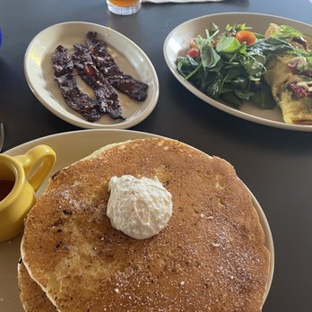 Snooze, an A.M. Eatery - Lemon Lavender pancakes with cream and lemon lavender honey syrup! bacon but different - crazy flavorful! - Breakfast & Brunch Near Me - Tucson, Arizona