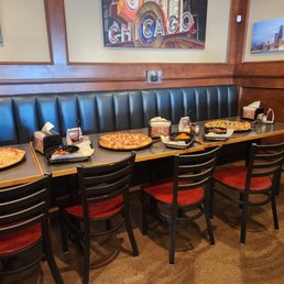 a long table with pizzas on it