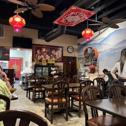 people sitting at tables in a restaurant people sitting at tables in a restaurant
