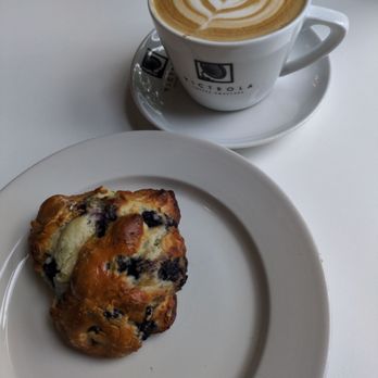 Victrola Coffee Roasters - Carmel Latte and blueberry scone - Coffee Roasteries Near Me - Seattle, Washington Victrola Coffee Roasters - Carmel Latte and blueberry scone - Coffee Roasteries Near Me - Seattle, Washington