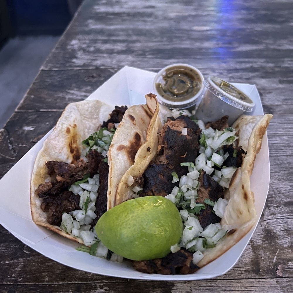 Smoked Brisket en Mole Tamarindo Taco and lamb barbocoa taco Smoked Brisket en Mole Tamarindo Taco and lamb barbocoa taco