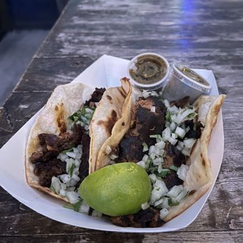 Asador - Smoked Brisket en Mole Tamarindo Taco and lamb barbocoa taco - Tacos Near Me - Austin, Texas