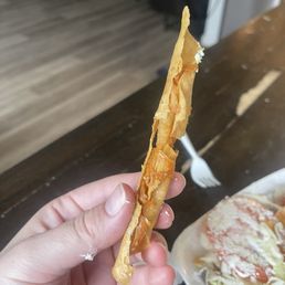 This is a rolled fried chicken taco. Literally one little piece of chicken inside and so crunchy This is a rolled fried chicken taco. Literally one little piece of chicken inside and so crunchy