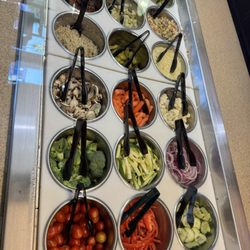 The salad bar looks so fresh and appealing