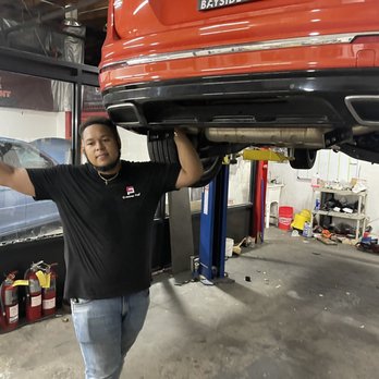 Idea First Motorsport  - Eddie Hernandez, the Store Manager of Idea First Automotive, Inc., inspecting my Volswagen Tiguan R Line SUV. - Auto Customization Near Me - New Hyde Park, New York