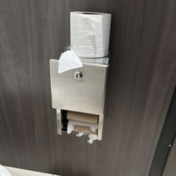 La Quinta Inn & Suites - 8:30am in the front lobby bathroom. Instead of refilling, there is a roll thrown on top?