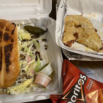 Al Chile Taqueria - a sandwich in a styrofoam container - Tacos Near Me - Dallas, Texas