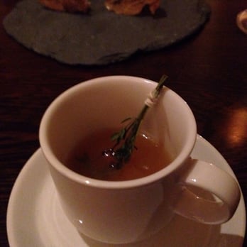 Fork - Terroir course 3 and 4 Potato "tea" with lavender branch and crispy chicken skin filled with almond cheese in the background - New American Near Me - Philadelphia, Pennsylvania Fork - Terroir course 3 and 4 Potato "tea" with lavender branch and crispy chicken skin filled with almond cheese in the background - New American Near Me - Philadelphia, Pennsylvania