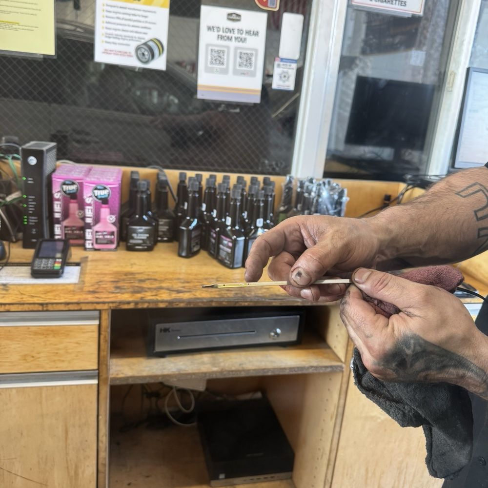 Oil Changers - Showing clean oil and oil level after oil changer - Oil Change Stations Near Me - Livermore, California Oil Changers - Showing clean oil and oil level after oil changer - Oil Change Stations Near Me - Livermore, California