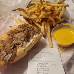 Half a cheesesteak and cheese fries Half a cheesesteak and cheese fries