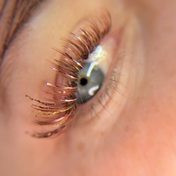Un-Stripped Lash + Brow Bar - Colored brown, orange and burgundy lash extensions with added glitter and tinsel for Halloween! - Waxing Near Me - Martinez, California Un-Stripped Lash + Brow Bar - Colored brown, orange and burgundy lash extensions with added glitter and tinsel for Halloween! - Waxing Near Me - Martinez, California