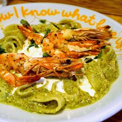 LIVIN'italy - Sicilian "Mezzi Paccheri": pasta tubes in cream of pistachio, topped with Stracciatella Mozzarella, giant prawn, olive oil & basil (£15.95).