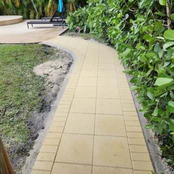 All Dade Pavers - a walkway in a garden - General Contractors Near Me - Doral, Florida