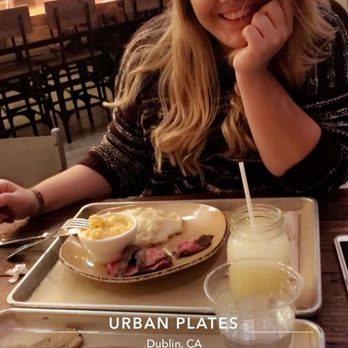 Urban Plates - A happy girl with a happy plate of Grilled Grass Fed Steak, Macaroni & Cheese, and mashed potatoes - New American Near Me - Dublin, California Urban Plates - A happy girl with a happy plate of Grilled Grass Fed Steak, Macaroni & Cheese, and mashed potatoes - New American Near Me - Dublin, California