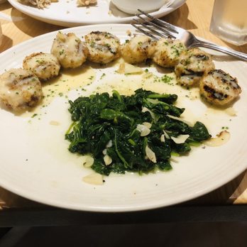 Carrabba's Italian Grill - Scallops Spiedino di Mare with sautéed spinach - Italian Near Me - Palm Coast, Florida