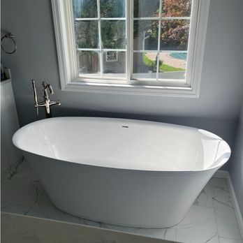 Selective Remodeling - Luxury bathroom renovation with a freestanding tub and spa-like finishes. Selective Remodeling specializes in high-end bathro... - General Contractors Near Me - Massapequa, New York