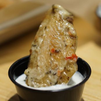 Buffalo Wild Wings - Garlic parmesan chicken wing dipped in ranch sauce (ohh-wee) - Sports Bars Near Me - Kaneohe, Hawaii Buffalo Wild Wings - Garlic parmesan chicken wing dipped in ranch sauce (ohh-wee) - Sports Bars Near Me - Kaneohe, Hawaii