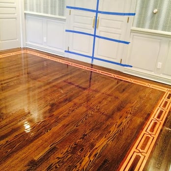 Russo's Flooring - a hardwood floor being painted - Flooring Near Me - Woodmere, New York Russo's Flooring - a hardwood floor being painted - Flooring Near Me - Woodmere, New York
