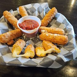 Bennigan's - Mozzarella sticks hand a nice hard coating gooey center