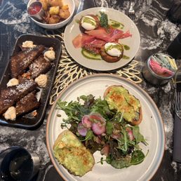 Avocado toast, banana bread, eggs in a hole, potatoes