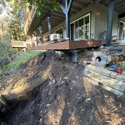 The corner of the deck was 14 inches low and the corner of the house was 4 inches low.
