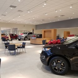 DARCARS Lanham Kia - Brand New New Car Showroom with vehicles dressed up for the holiday!