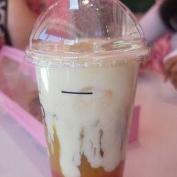 Pineapple green tea with strawberry popping boba