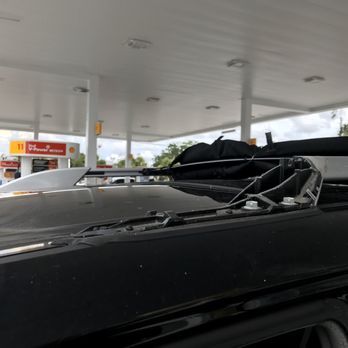 Rally Stores - a car with luggage on top - Convenience Stores Near Me - Dunedin, Florida