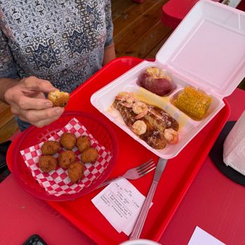 Te'Jun, The Texas Cajun- Keller - Blackened fish, added hush puppies, potato, Cobb corn - Seafood Near Me - Keller, Texas