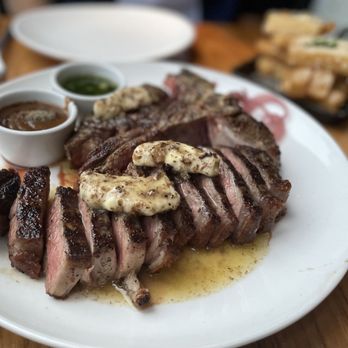 STK Steakhouse - Porterhouse with Truffle Butter Glazed,  Au Poivre and Chimichurri sauce - Steakhouses Near Me - Toronto, Ontario