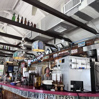 Mrs Mac's Kitchen - Overseas Hwy - a woman sitting at the bar - American Near Me - Key Largo, Florida Mrs Mac's Kitchen - Overseas Hwy - a woman sitting at the bar - American Near Me - Key Largo, Florida