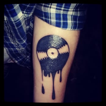 The Tattoo Gallery - Melting record by Jasin at Tattoo Gallery HB - Tattoo Near Me - Huntington Beach, California