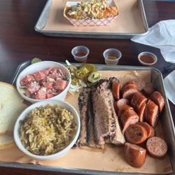Fire Craft BBQ - Two meat plate with mixed cut brisket, mild sausage with a side of dirty rice and watermelon salad.