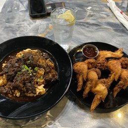 Oxtail and Grits w/ Fried chicken on the right