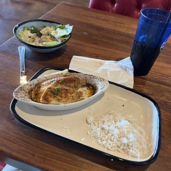 Crabby's Oceanside - Stuffed flounder and coconut rice.  House salad in back. - Seafood Near Me - Daytona Beach, Florida