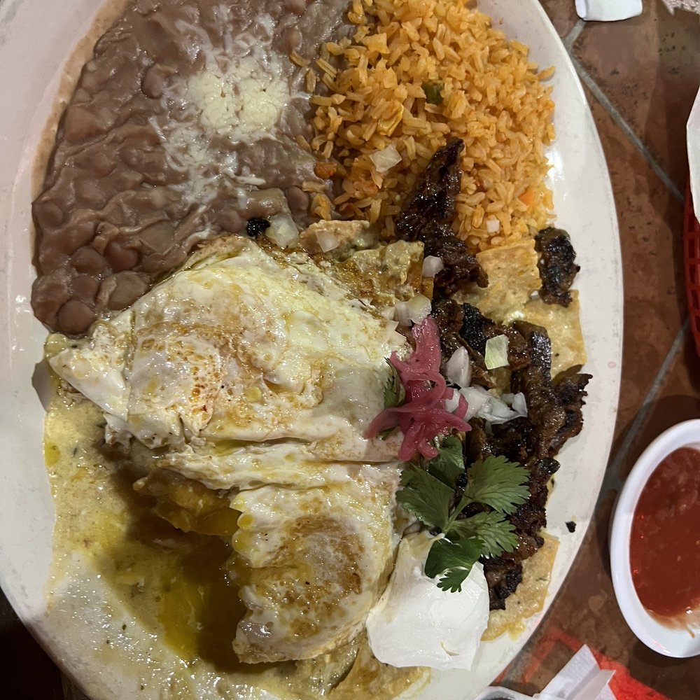 Don Eladio's Cantina - Chiliquelis with green sauce, over easy egg and steak. - Mexican Near Me - King George, Virginia Don Eladio's Cantina - Chiliquelis with green sauce, over easy egg and steak. - Mexican Near Me - King George, Virginia