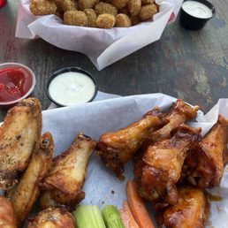 Some tots with bone in wings habanero and lemon pepper wings Some tots with bone in wings habanero and lemon pepper wings