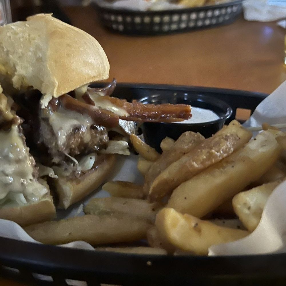 Portabello Mushroom bacon burger + fries with our bar cheeseburger in the background Portabello Mushroom bacon burger + fries with our bar cheeseburger in the background